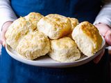 Southern Biscuits with White Lily Flour - hands holding a plate of biscuits