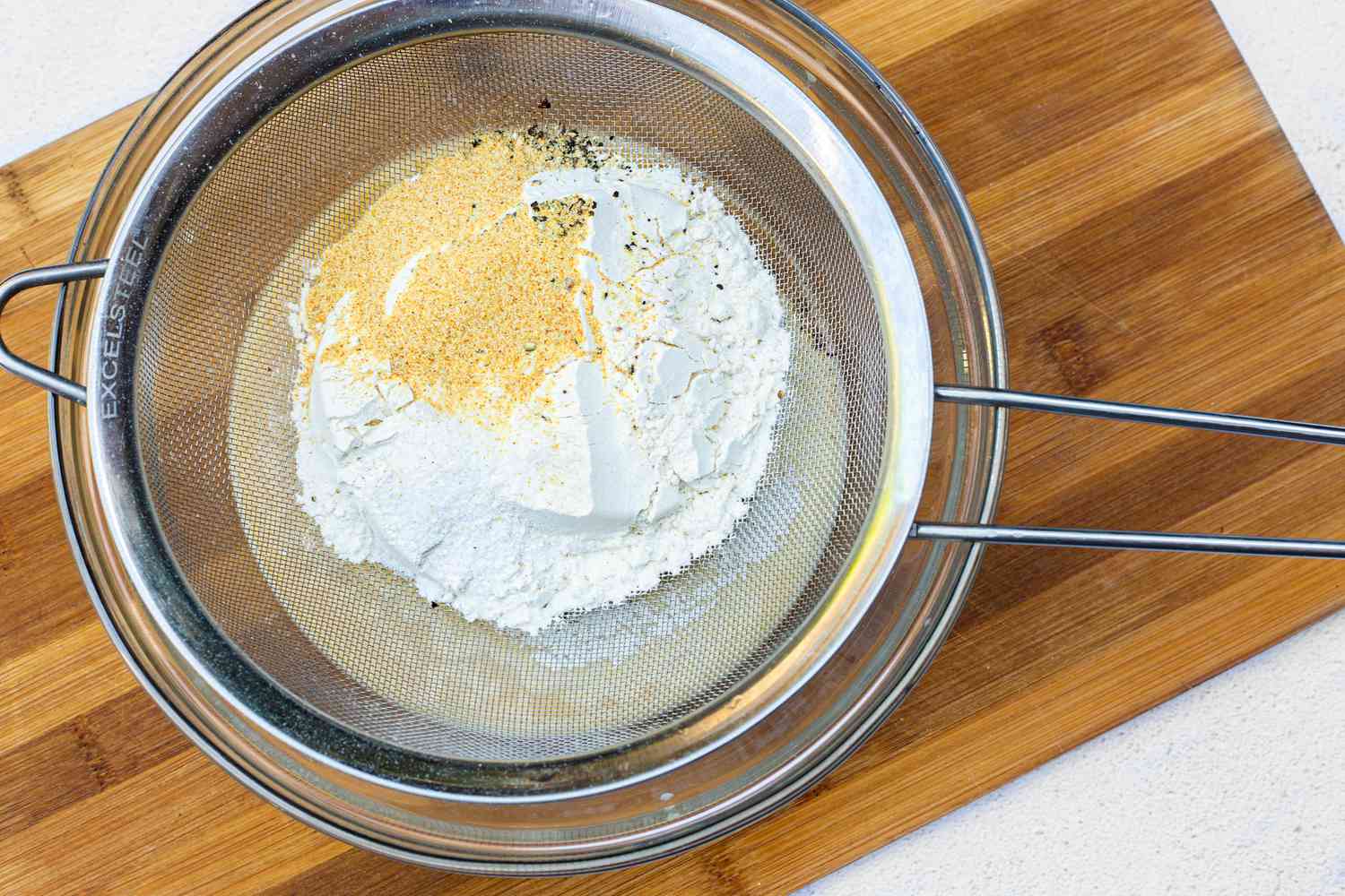 Dry Ingredients Sifted into Bowl of Wet Ingredients for Fried Mushrooms