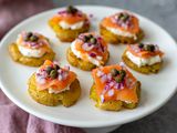 A platter of smoked salmon-topped potatoes.