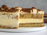 Side view of tiramisu cake cut into.