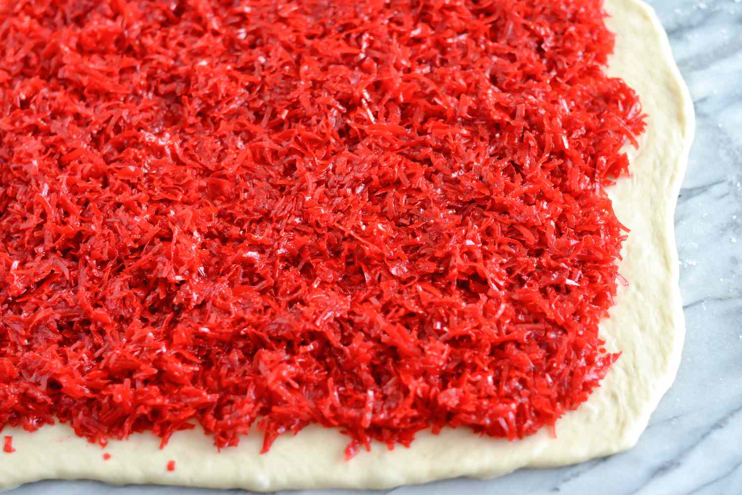 Filling dough with coconut filling for salara