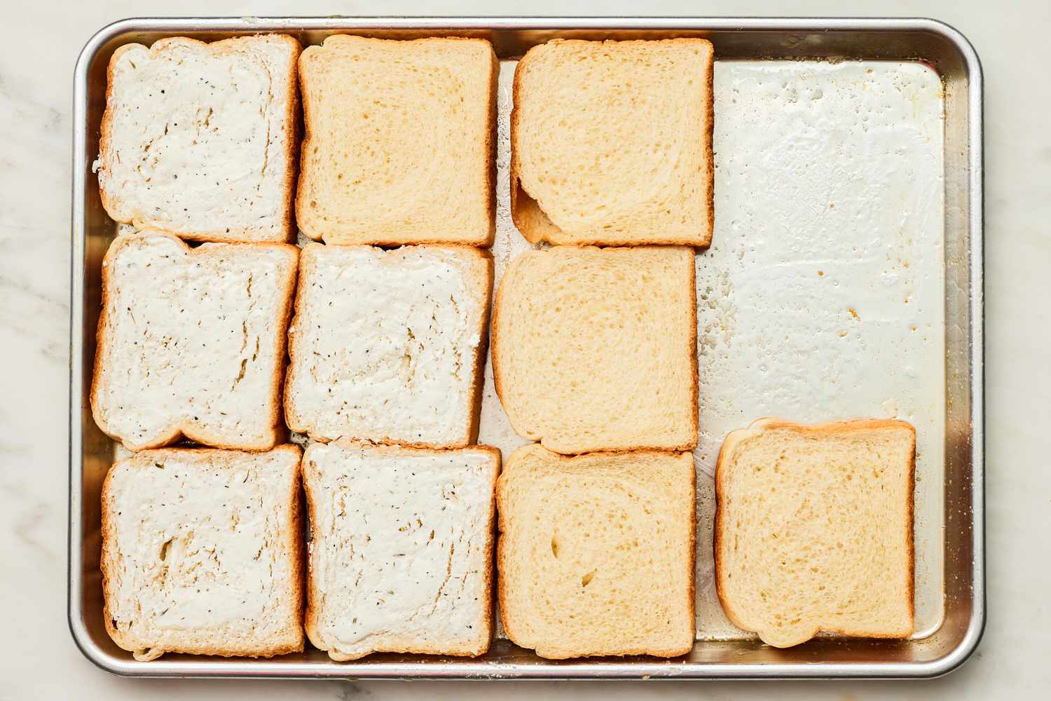 Goat Cheese Covered Slices of Bread and Plain Slices of Bread the Butter Lined Baking Pan for Sheet Pan Grilled Cheese Sandwich Recipe 