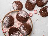 Overhead view of holiday chocolate and peppermint shortbread on a platter with crushed peppermint around it.