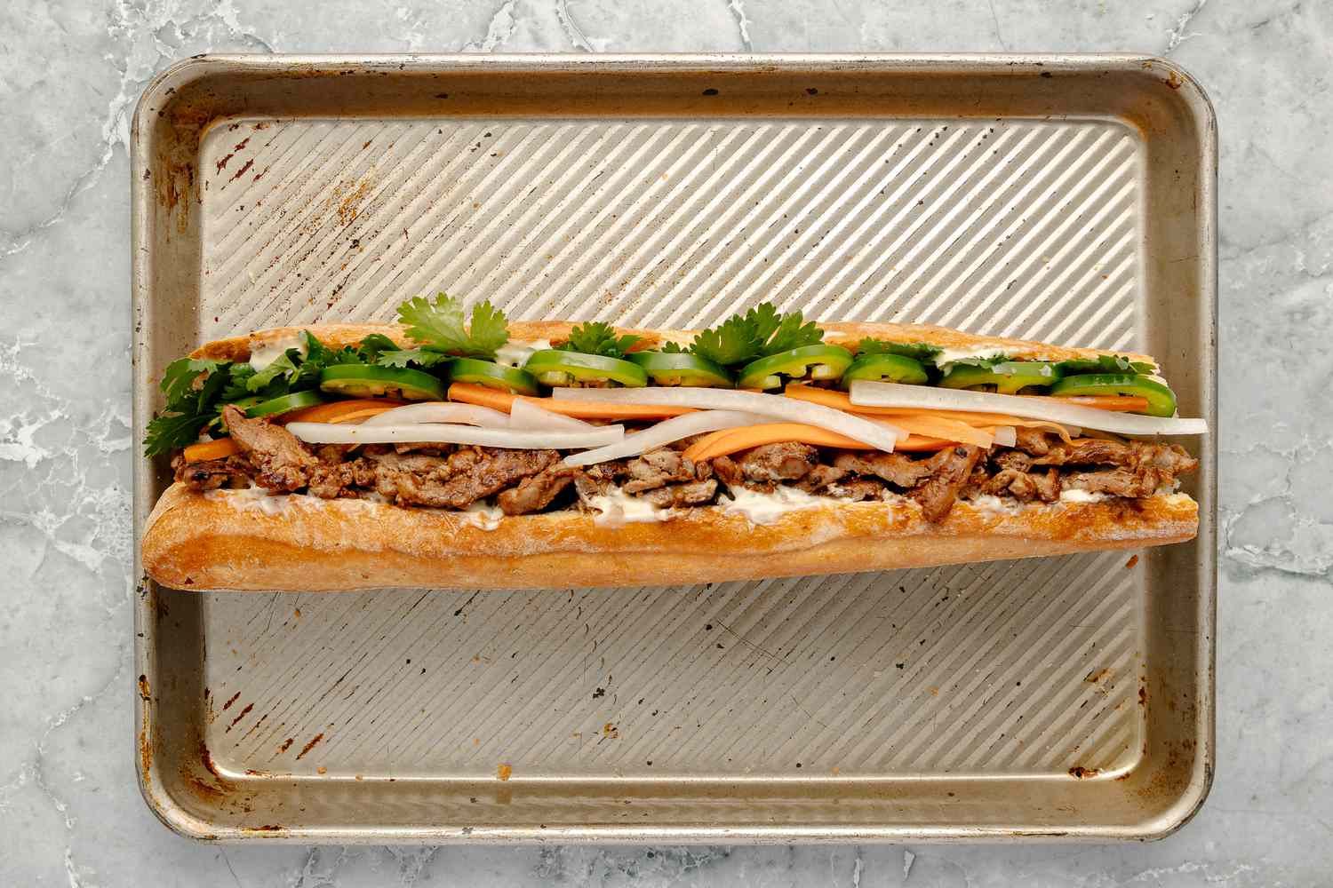 Banh Mi Filled with Pork, Pickles, Cilantro, and Jalapenos 