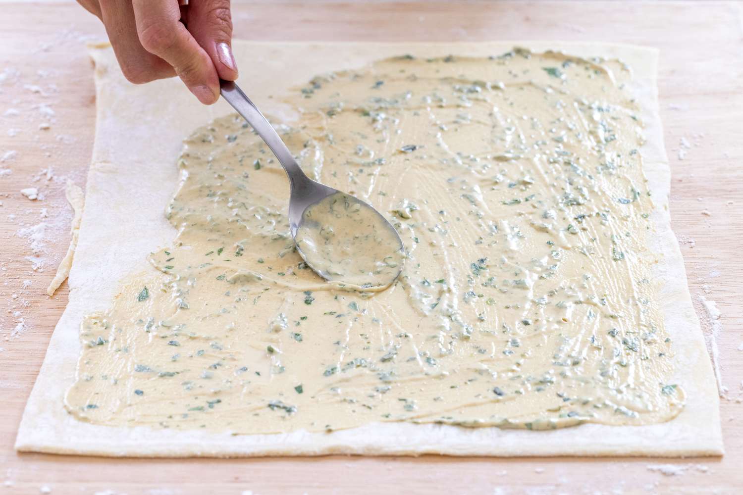 Filling puff pastry to make savory pinwheels.