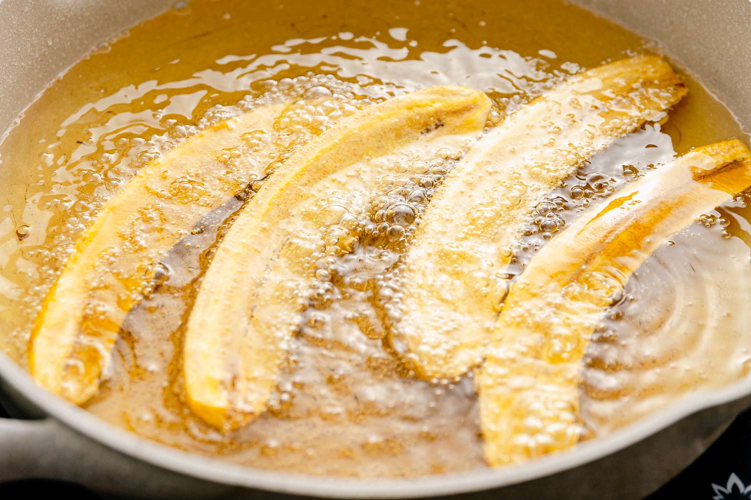 Frying Plantains in Pot of Oil for Jibarito Recipe