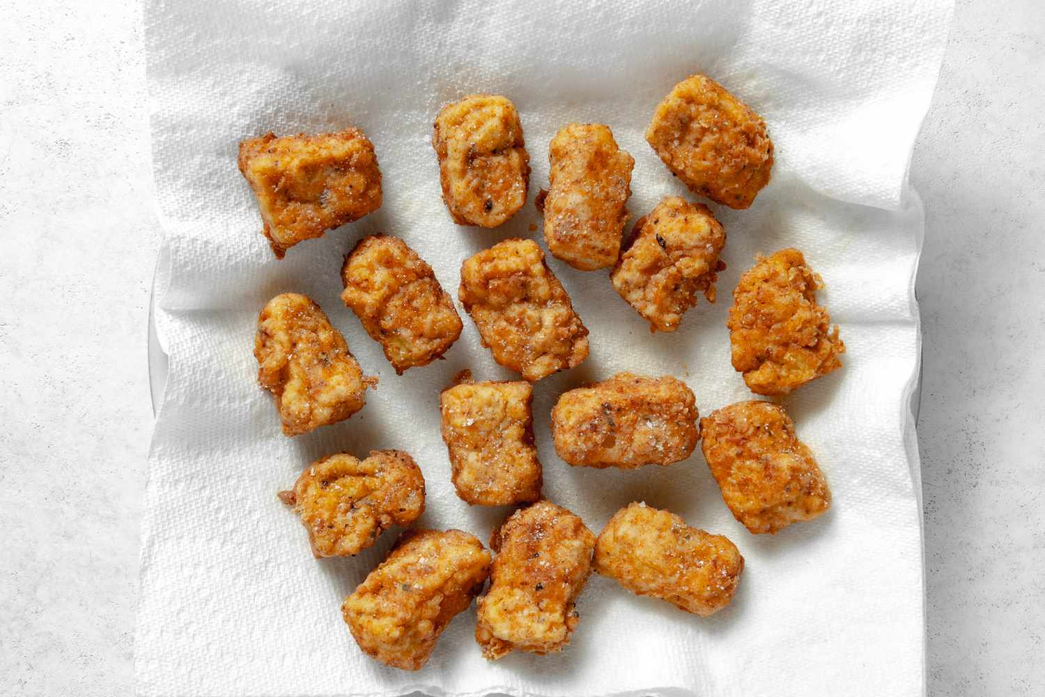 Vegan Chicken Nuggets Resting on a Paper Towel Lined Plate 