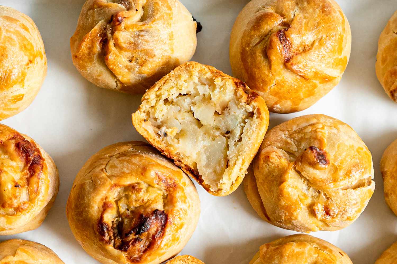 Potato Knishes on Tray with One Cut