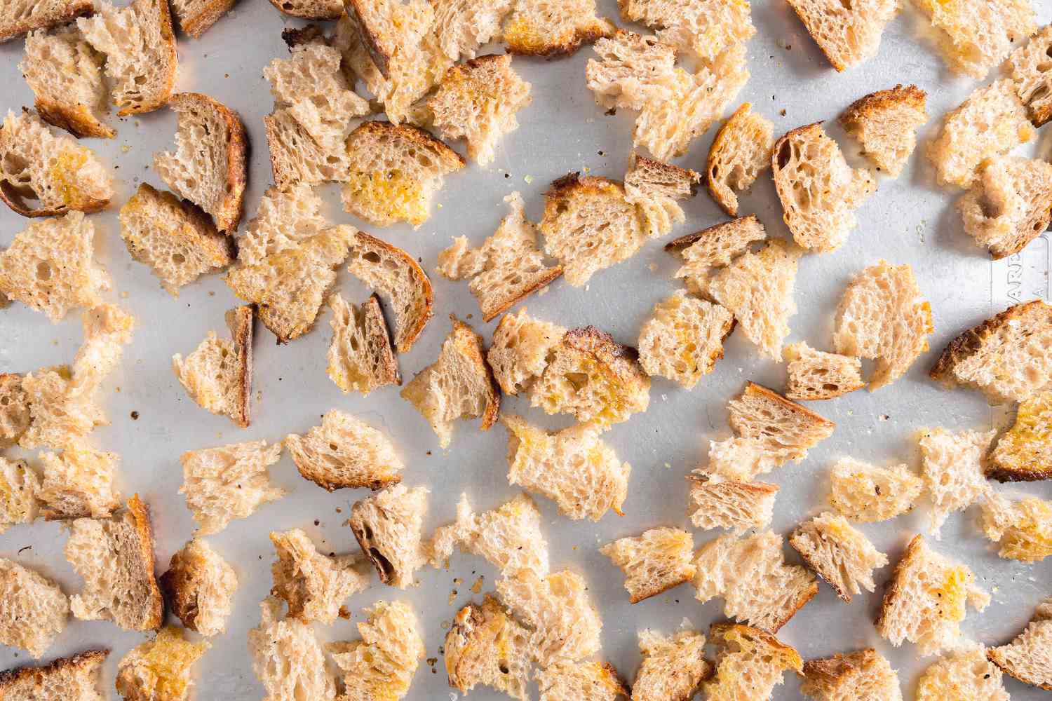 Seasoned Bread Pieces on a Sheet Pan for Roasted Root Vegetable Panzanella