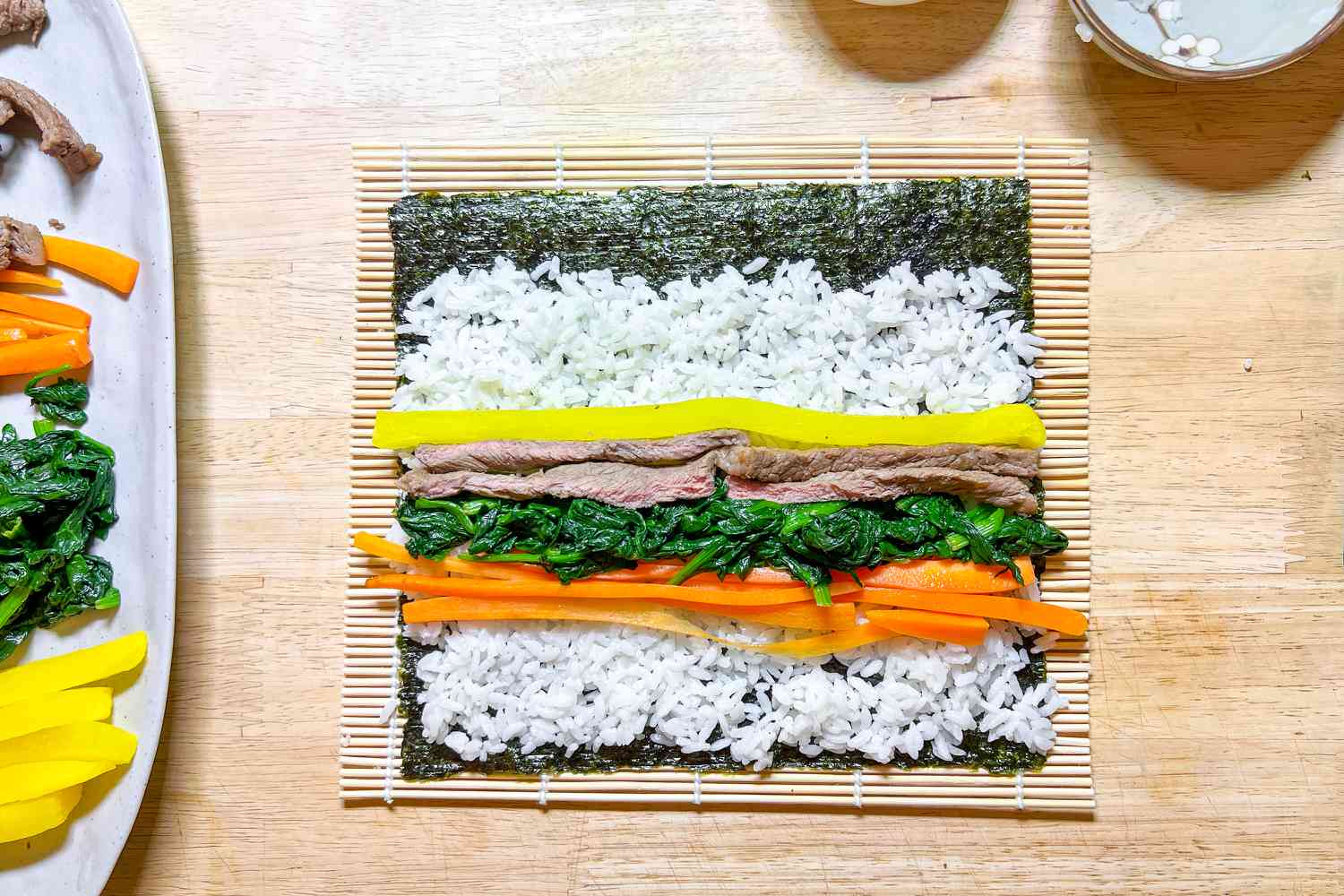 Danmuji, Spinach, Carrots, and Beef on Rice Covered Seaweed for Kimbap