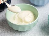 Easy Homemade Vanilla Pudding in Multiple Bowls with Some on a Spoon