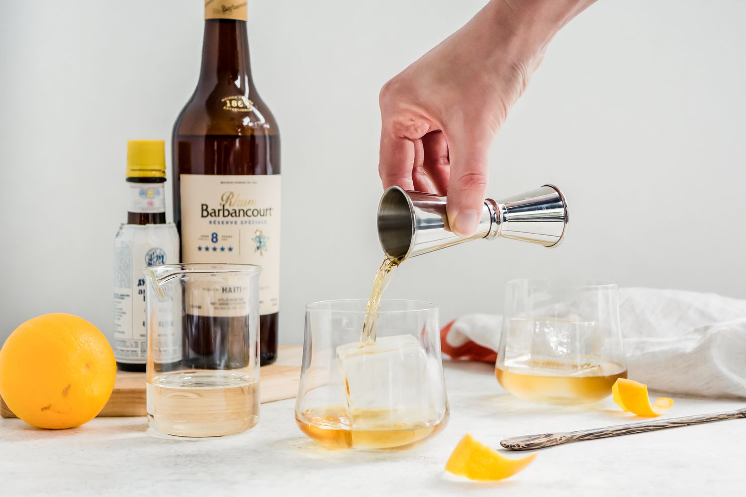 Rum Poured into a Glass with Ice for Old Fashioned Recipe