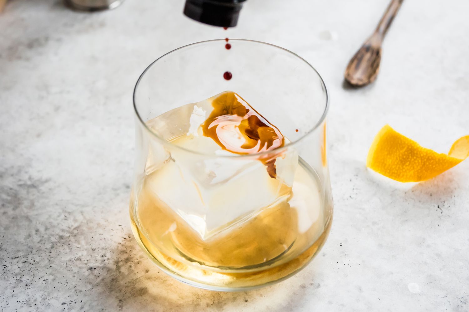 Bitters Added to Glass for Rum Old Fashioned Recipe