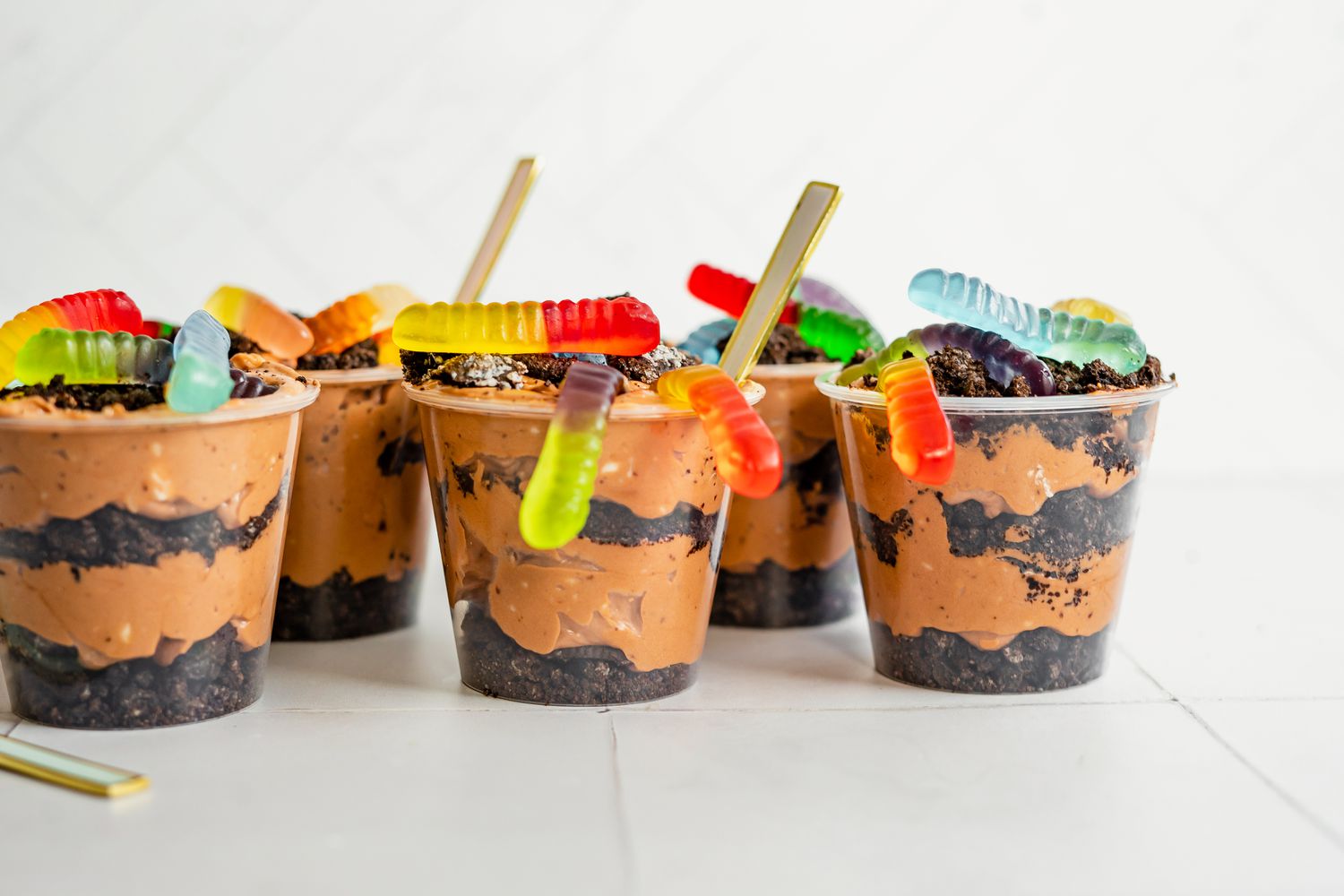 Cups of Dirt Cake with Gummy Worms and Spoons