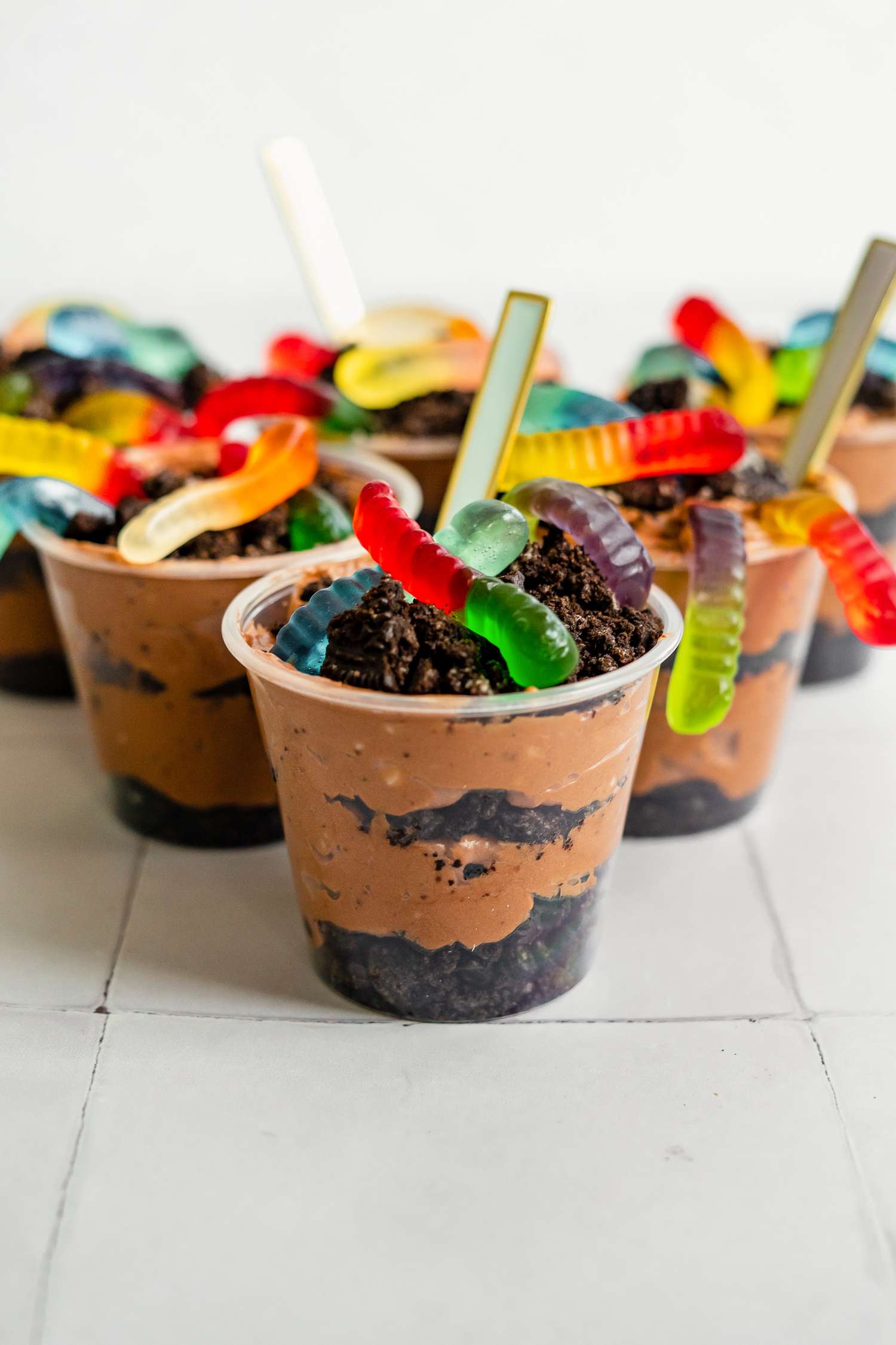 Cups of Dirt Cake with Gummy Worms and Spoons