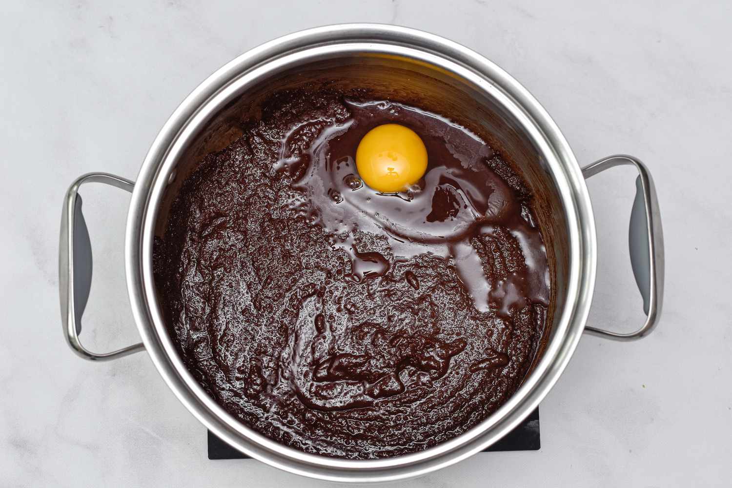 Egg added to brownie batter to make Salted Caramel Brownies 