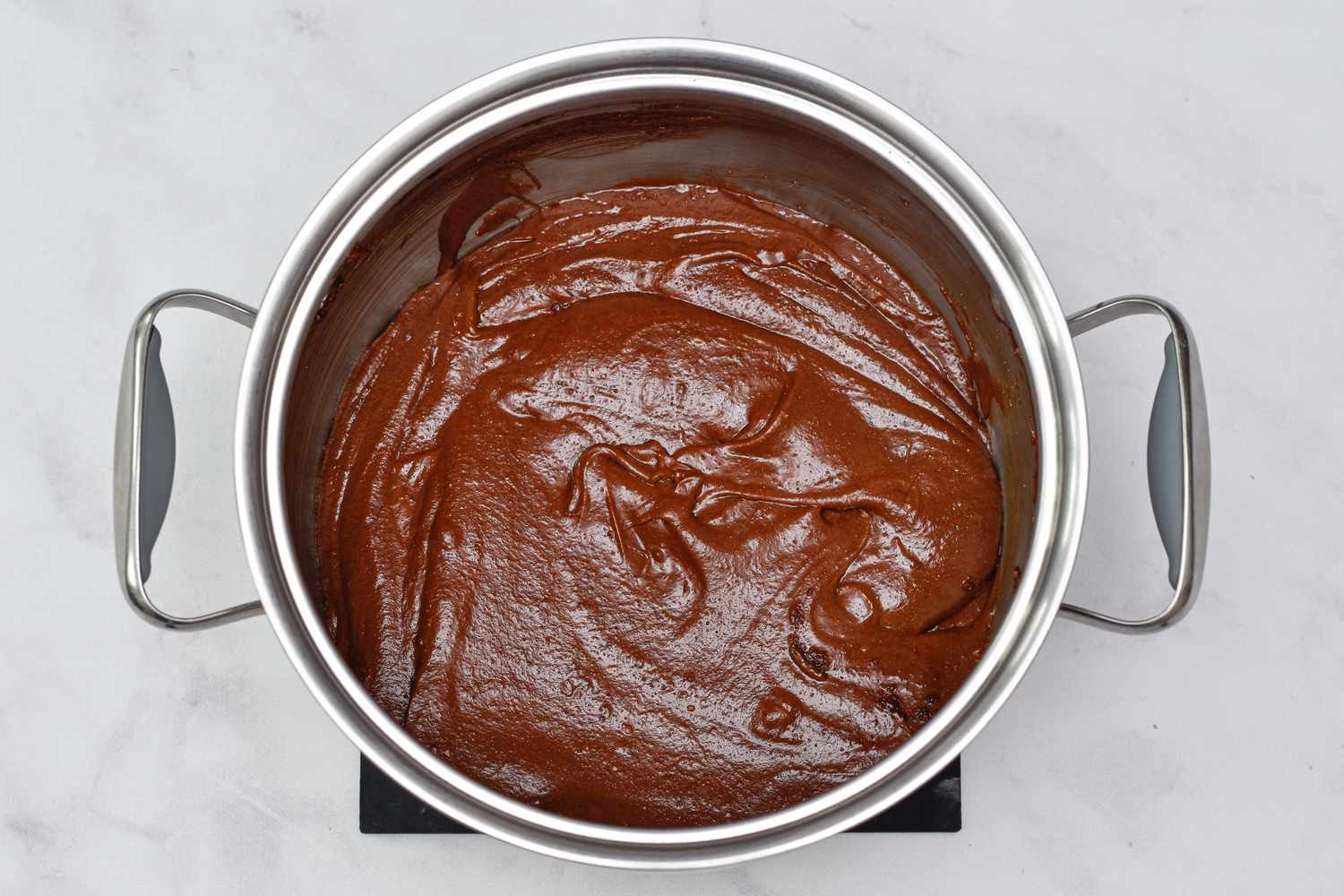 Smooth brownie batter in a pot to make The Best Salted Caramel Brownies