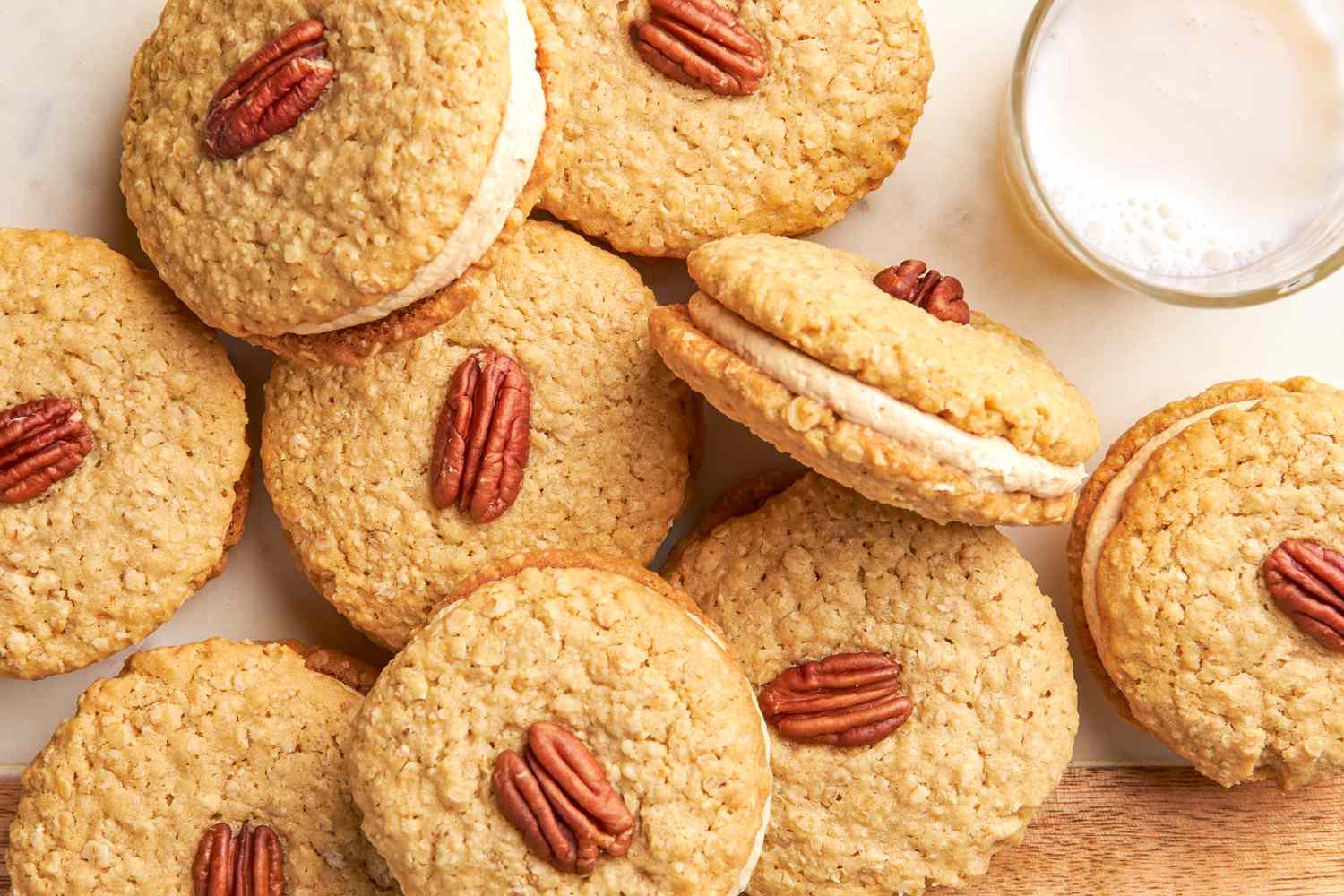 Yellowhammer cookies on the counter next to a glass of milk