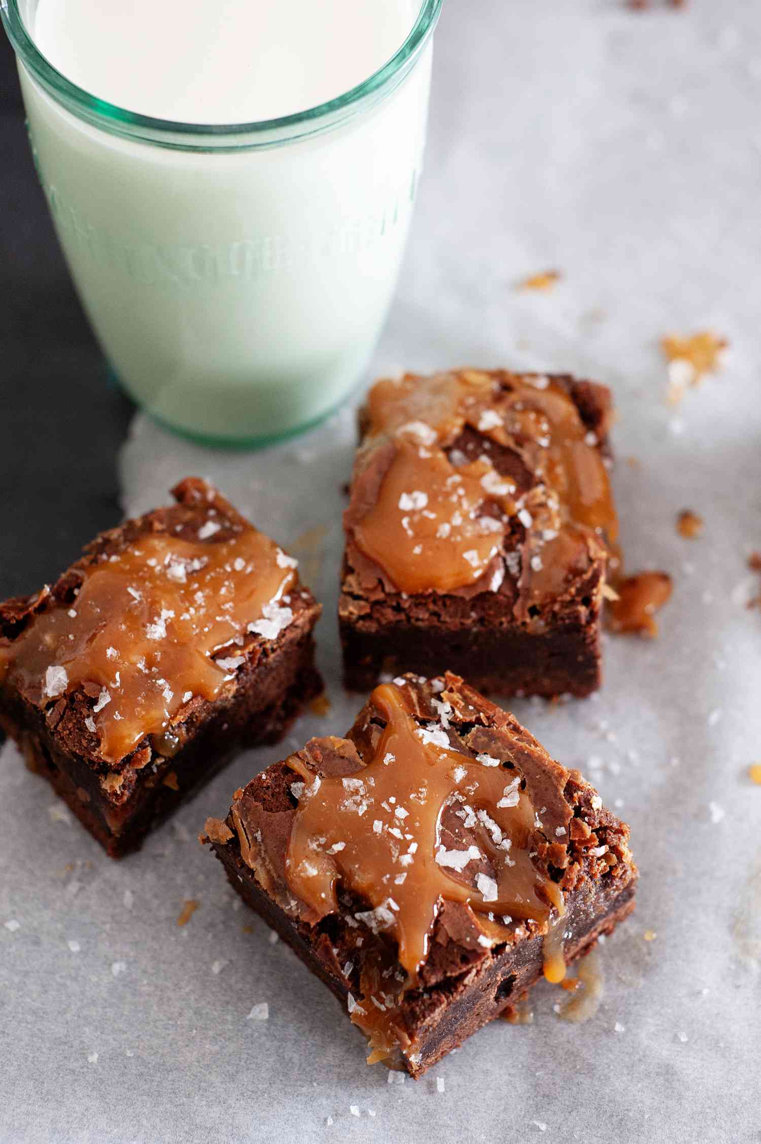 Fudgy Caramel Swirl Brownies with a glass of milk