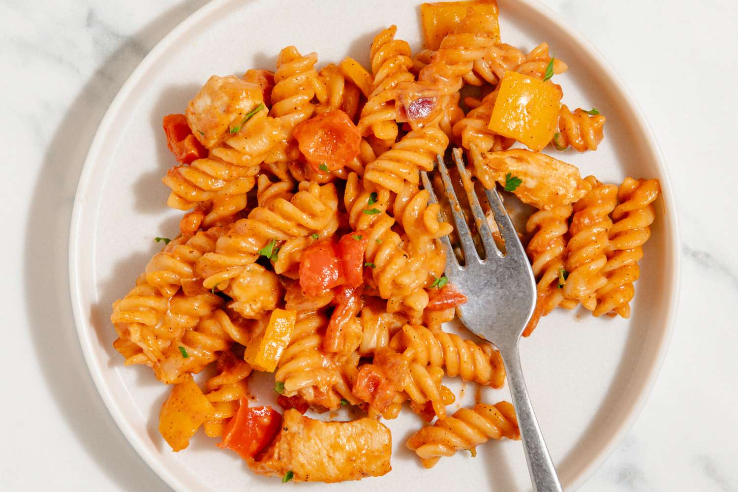 One-Pan Chicken Fajita Pasta on a plate with a fork