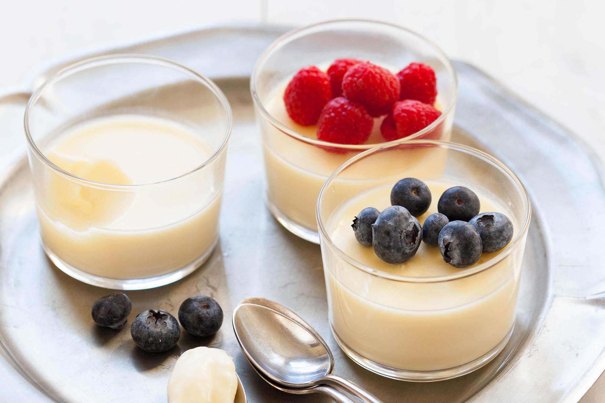 Easy Lemon Pudding in three cups topped with berries