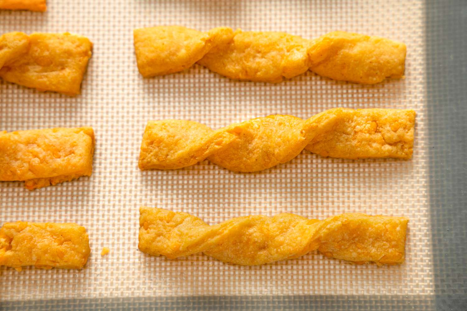 Cheese Sticks on a Lined Baking Sheet