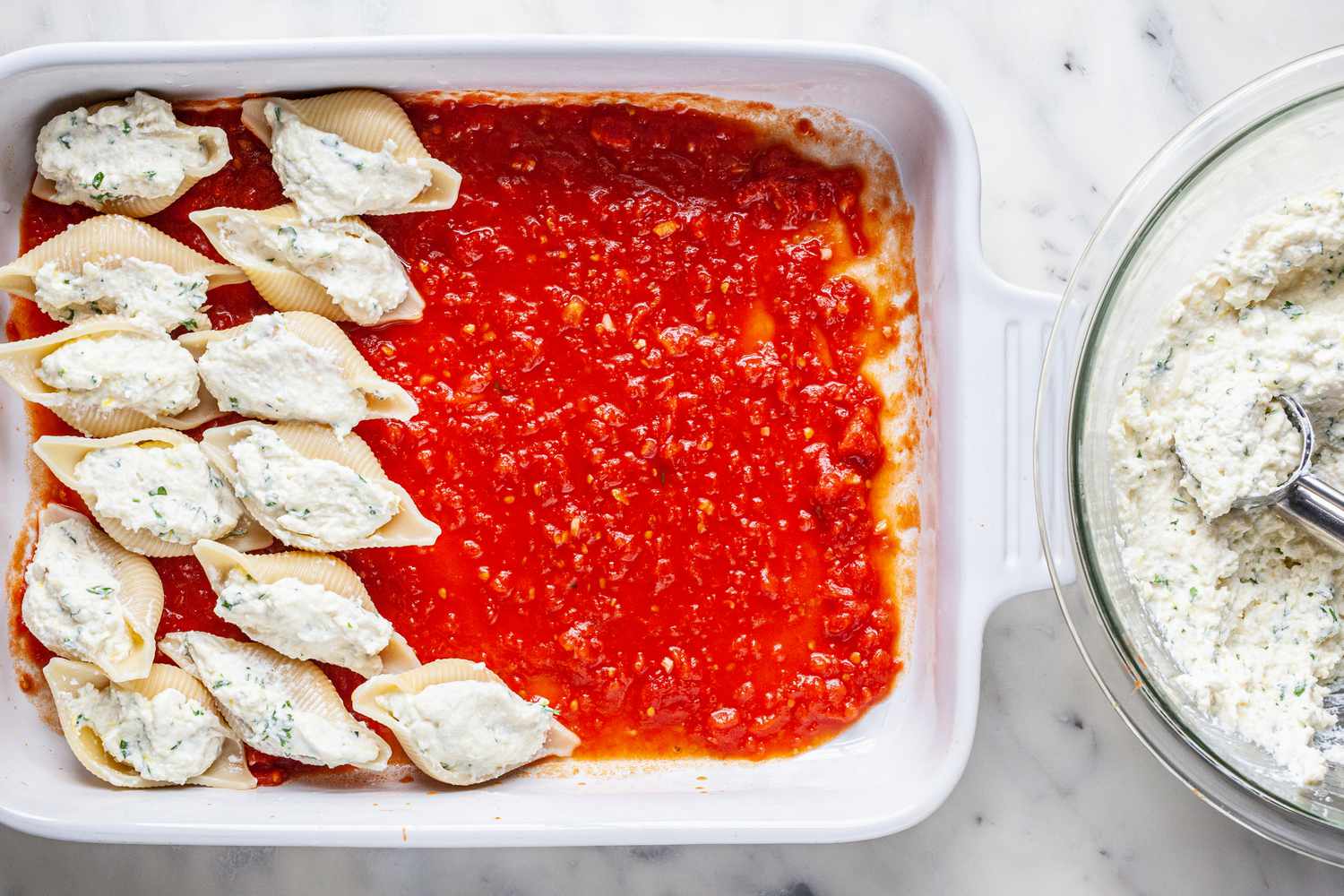 Jumbo Shells Stuffed with Ricotta Filling Placed on a Casserole Dish