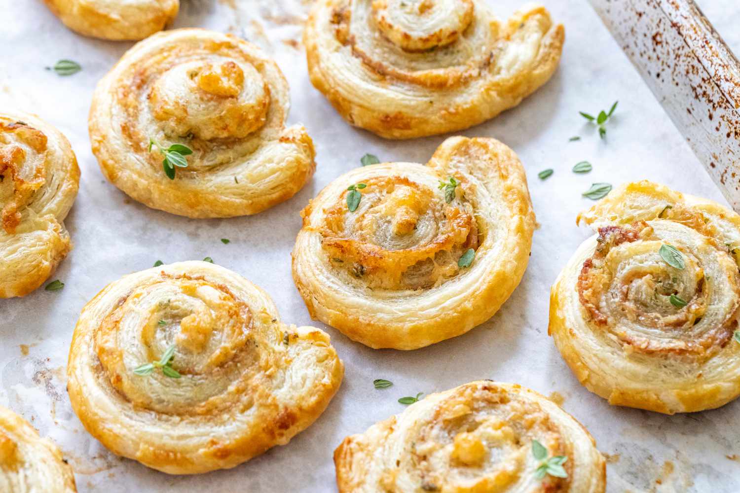 Savory pinwheels on a white platter.